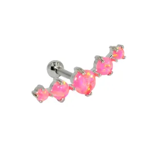 Stainless steel pink opal curved cartilage piercing earring stud, body jewelry detail shot.