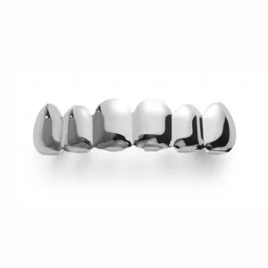 Close-up detail shot of silver hip hop grillz teeth jewelry, shiny metal surface finish.