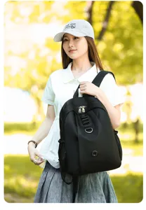 Black nylon casual backpack detail view, lightweight versatile daypack for outdoor travel daily use.