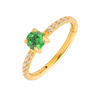 G23 titanium alloy hinged segment nose ring with green zirconia and clear crystals.