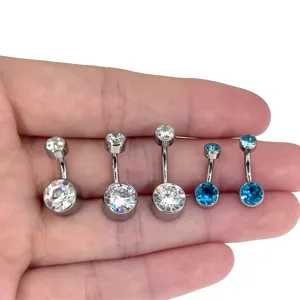 Close-up detail of double zircon titanium belly button ring, showing clear stone sparkle and metal finish.