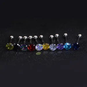 Close-up detail view of colorful round zircon tongue piercing barbell rings with ball ends.