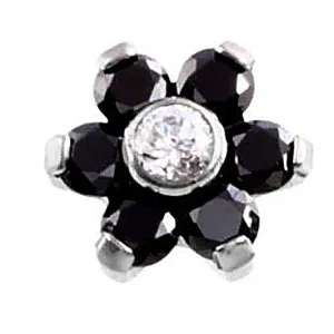 Close-up detail shot of a flower piercing top featuring black and white zircon stones.