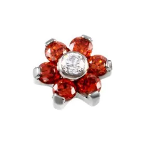 Detailed view of a flower dermal piercing top featuring red and clear cubic zirconia stones.