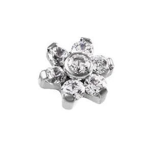 Detailed close-up of a floral body piercing top featuring sparkling cubic zirconia stones.