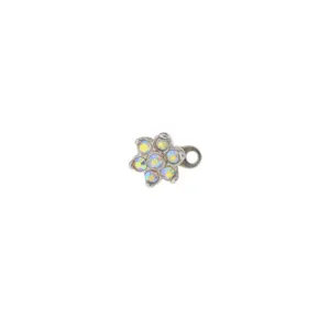 Dermal anchor top featuring a sparkling crystal flower design with a small attachment ring.