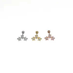 Detailed close up shot of stainless steel triple star cubic zirconia cartilage earring