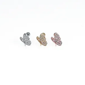 Close-up detail of butterfly zircon piercing stud earrings available in three stunning metallic finishes.