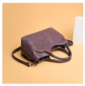Detail view of the soft PU leather handbag, showing its large capacity and shoulder strap.