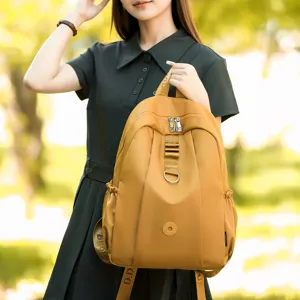 Stylish yellow nylon backpack for women, lightweight casual travel daypack with multi pockets.
