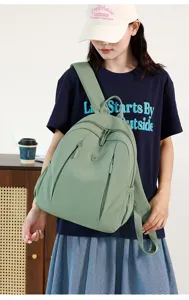 Green waterproof nylon casual backpack for women, trendy large capacity daily school bag.