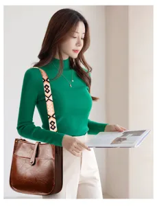 Stylish brown leather bucket shoulder bag with patterned strap for daily commute.
