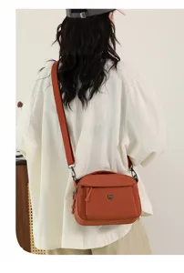 Casual multi-layer fabric crossbody shoulder bag for women, lightweight everyday fashion purse.