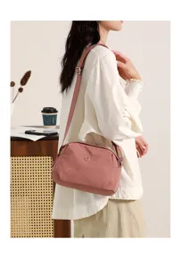 Stylish minimalist pink shell shoulder crossbody bag for women, casual fabric cloth handbag.