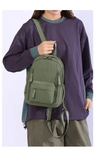 Close-up view of the casual green small backpack detail, showing strap and pocket.