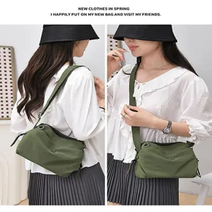 Detailed view of the lightweight nylon crossbody bag showing dual wearing angles and strap.