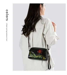 Retro embossed leather shoulder bag, ethnic style carved floral crossbody bag for women daily use.