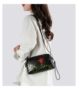 Ethnic style embossed lotus shoulder bag for women, retro vintage leather crossbody bag.
