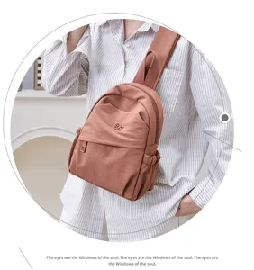 Detailed view of the casual nylon backpack showcasing the smooth zipper and fabric texture.