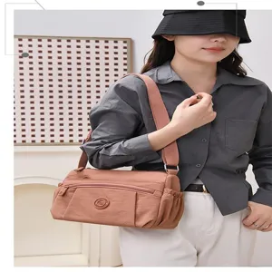 Casual nylon crossbody shoulder bag for women, multi-pocket design, large capacity daily use.