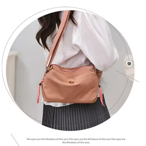 Casual nylon shoulder bag for women, lightweight crossbody design with adjustable strap.