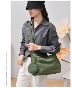 Detail view of the large capacity casual shoulder bag in green, showing daily commuting style.