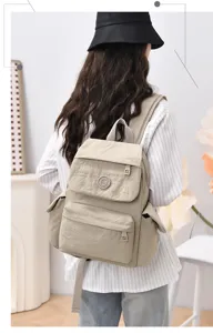 Casual minimalist nylon backpack with large capacity for women, stylish travel school bag.