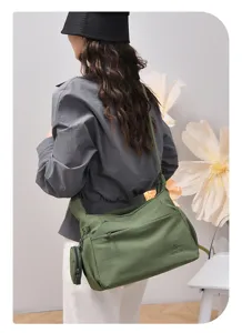 Large capacity casual shoulder bag for women, stylish green nylon hobo tote bag for daily commute.