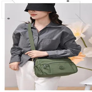 Casual nylon crossbody bag for women, multi-pocket design, large capacity shoulder bag.