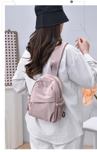 Casual nylon mini backpack for women, lightweight solid color travel daypack daily use.