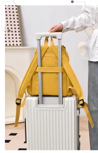 Backpack travel detail view showing convenient luggage trolley strap for easy carrying.