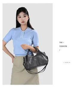 Detailed close-up view of women's soft PU leather shoulder bag, casual large capacity tote.