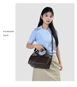 Close-up detail of the dark brown soft PU leather women shoulder handbag, elegant style.