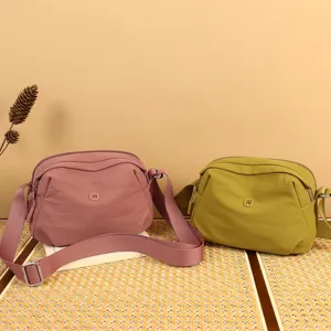 Casual nylon shell crossbody bag for women, stylish daily shoulder bag with wide strap.