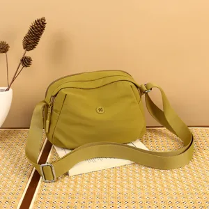 Women minimalist nylon crossbody shell bag in olive green with wide strap for casual daily use