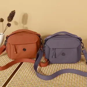 Women casual nylon shoulder crossbody bag multi-layer lightweight daily fashion handbag.