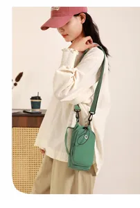 Minimalist solid color green crossbody phone bag detail view, stylish casual daily shoulder bag.