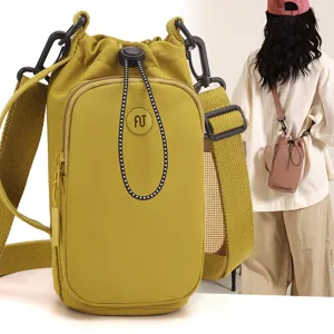 Korean style minimalist crossbody bag with drawstring closure and front pocket for summer daily wear.