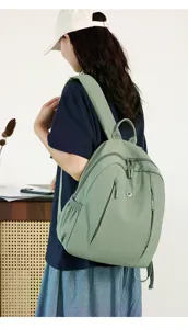 Women's casual waterproof nylon backpack, trendy simple large capacity school travel daypack.
