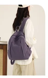 Stylish waterproof nylon casual backpack for women, large capacity daily school travel bag.