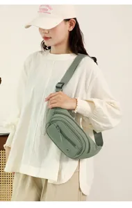 Casual women's green sling bag, multi-pocket canvas chest bag for daily fashion and travel.