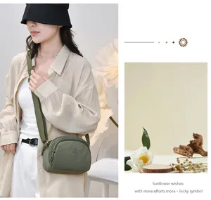 Sac bandoulière décontracté en nylon pour femme, sac de voyage multi-compartiments sangle large.