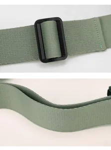 Green adjustable bag strap close-up detail, durable webbing and plastic buckle part.