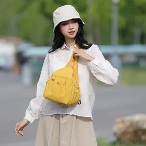 2024 summer new women's yellow canvas sling chest bag, stylish commuting outdoor casual crossbody bag.