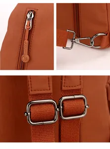 Nylon chest bag detail shot, showing durable metal hardware, smooth zipper, and adjustable straps.