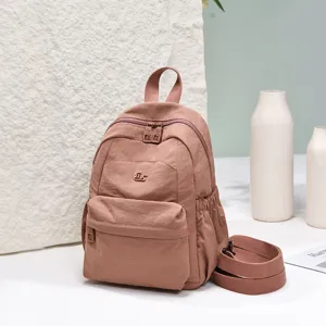 Stylish women casual mini backpack in dusty pink nylon, great for daily commute, travel and school.