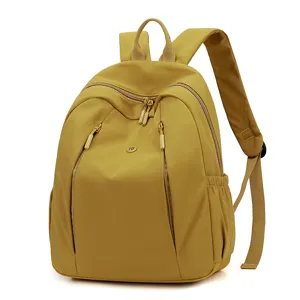 Waterproof nylon casual women's backpack with large capacity and multiple zipper pockets.