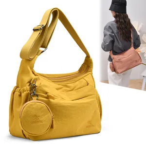 Large capacity casual nylon shoulder bag with coin purse, trendy cross-body tote for women.