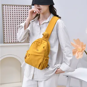 Casual solid color nylon backpack for women, lightweight retro daypack for travel and daily use.
