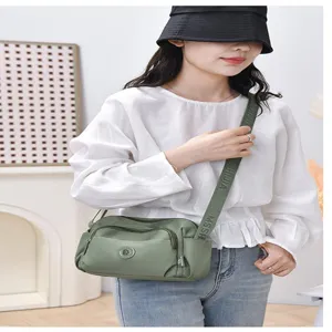 Green multi-pocket crossbody shoulder bag for women, large capacity casual commuting bag.